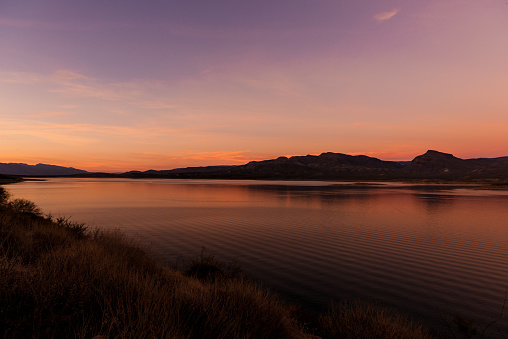 Arizona sunset over the Roosevelt Lake at the end of the apache trail.