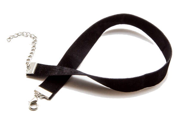 istock Black ribbon on the neck isolated on white 907857010