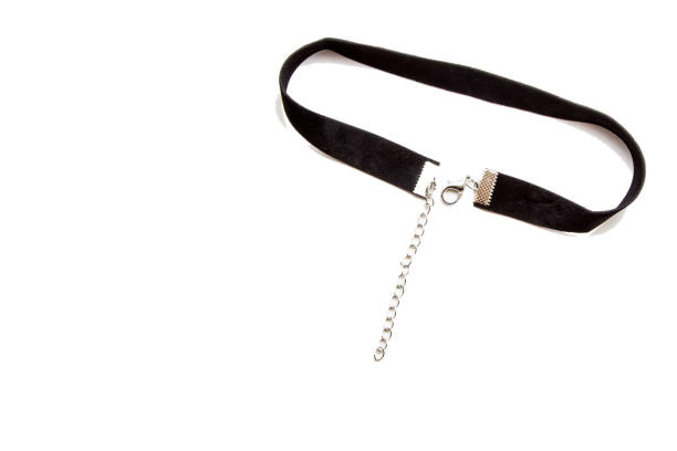 istock Black ribbon on the neck isolated on white 907857038