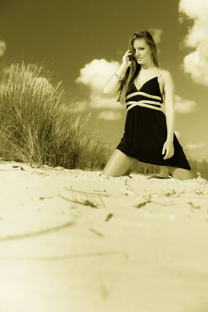 Beautiful woman posing - freedom gesture and spreading hands
