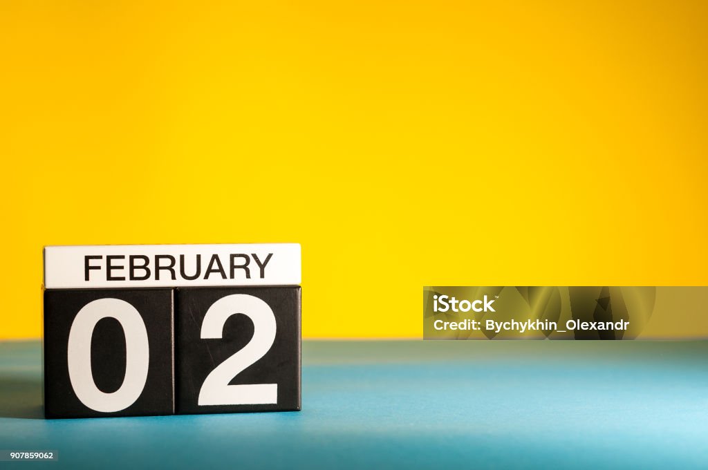 February 2nd. Day 2 of february month, calendar on yellow background. Winter time. Empty space for text February 2nd. Day 2 of february month, calendar on yellow background. Winter time. Empty space for text. 2018 Stock Photo