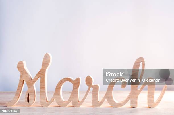 Word Month Of March Carved In Wood With Light Background Beginning Of Springtime Spring Hello Concept Stock Photo - Download Image Now