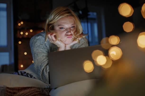 istock Dreamful girl relaxing on couch with coziness 907860990