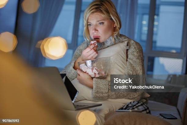 Pathetic Girl Observing Sad Film Stock Photo - Download Image Now - Eating, Food, Depression - Sadness