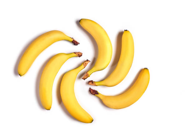 istock Ripe yellow bananas on a white background 907861664