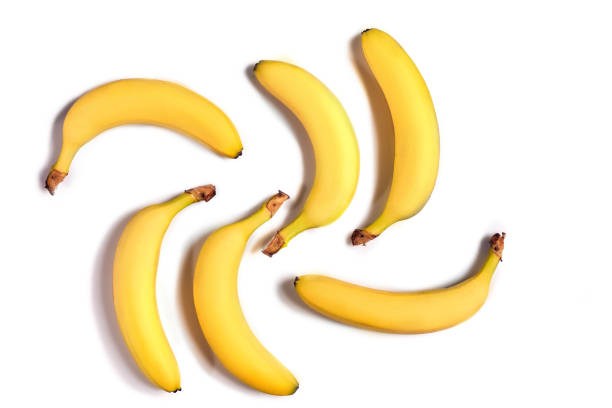 istock Ripe yellow bananas on a white background 907861870