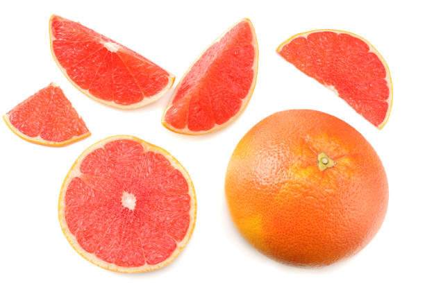istock healthy food. sliced grapefruit isolated on white background top view 907862370