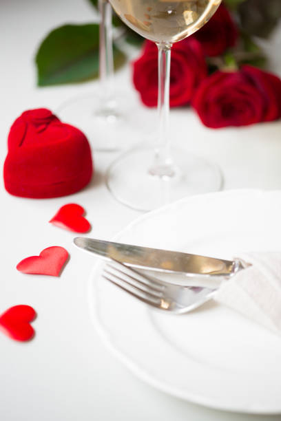 istock Valentines day or engagement marriage celebration concept dinner with wine and roses 907863208