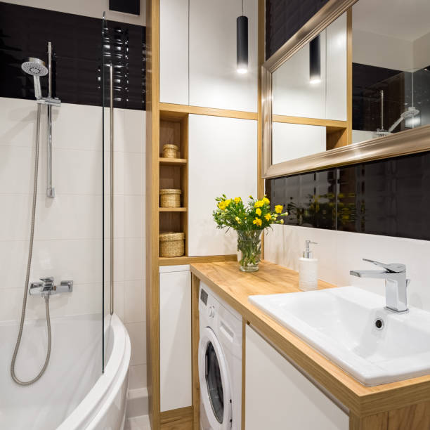 Black and white bathroom Black and white bathroom with shower and wooden cabinet mal stock pictures, royalty-free photos & images