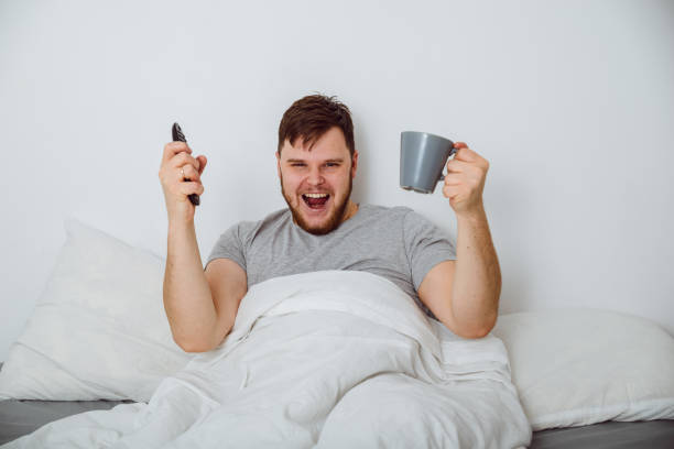 man in bed watch interesting match