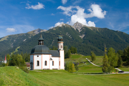 Small church with mountain backdrop - Seefeld, Austrian Alps. 
