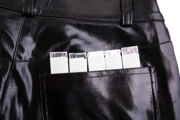 Chewing gums in the back pocket of black pants