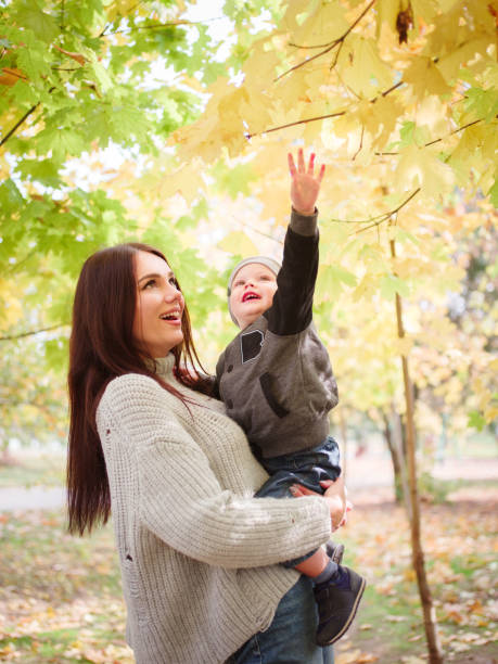 istock Mother with baby at outdoor 907868668