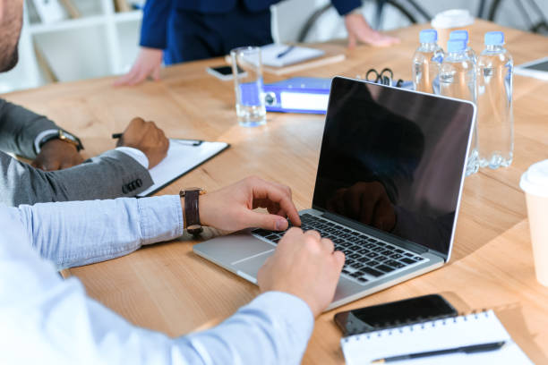 istock cropped image of multicultural businesspeople at meeting 907869608