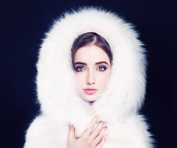 istock Pretty Woman in White Winter Fur 907869940