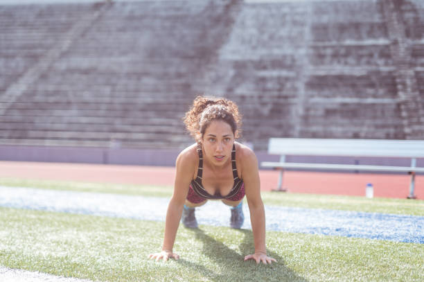 istock Female Athlete Cross Training at Stadium 907871088
