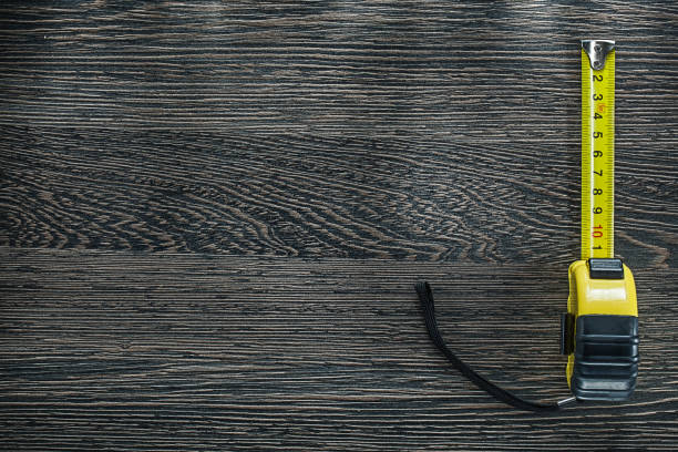 istock Tapeline on vintage wooden board copy space 907872752