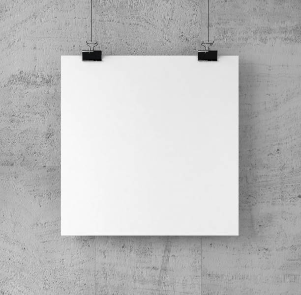 istock Square Shape Poster on binder clips on Concrete wall. 907873264
