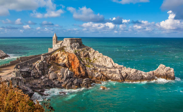 Seascape with Church of St Peter in Porto Venere, Italy Beautiful view of the famous gothic Church of St. Peter (Chiesa di San Pietro) in the town of Porto Venere, Ligurian Coast, province of La Spezia, Italy church of san pietro photos stock pictures, royalty-free photos & images