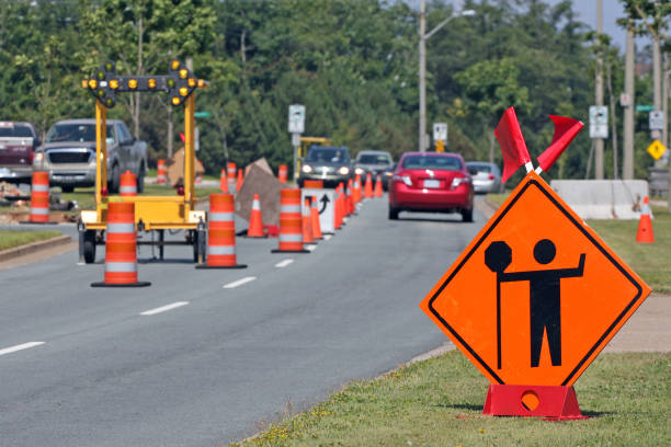 istock Flagman Ahead Sign On Road Construction Site 907874300