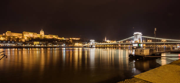 istock Beautiful Chain Bridge and Pariament at night wide angle. 907874928