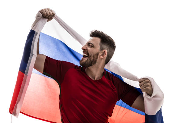 istock Russian male athlete / fan celebrating on white background 907876002