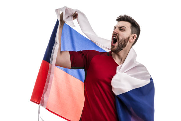 istock Russian male athlete / fan celebrating on white background 907876008