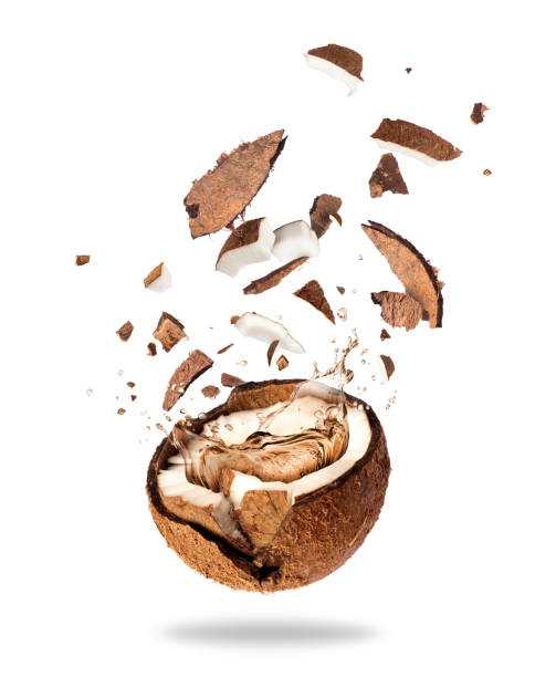 istock Broken coconut with of juice, isolated on white background 907877110
