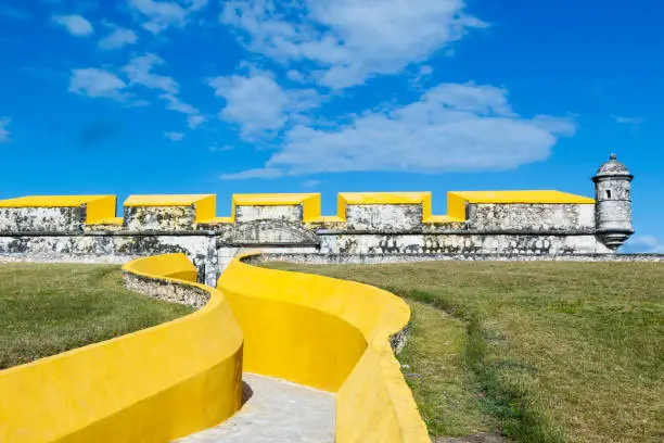 View of a corner of the San Jose Fort, entrance in the foreground, with a bartizan on top and the moat below, unesco world heritage site