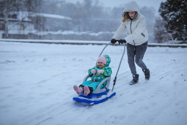 istock Winter is very fun mommy 907884020