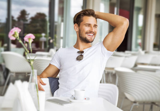 handsome man - hand in hair imagens e fotografias de stock