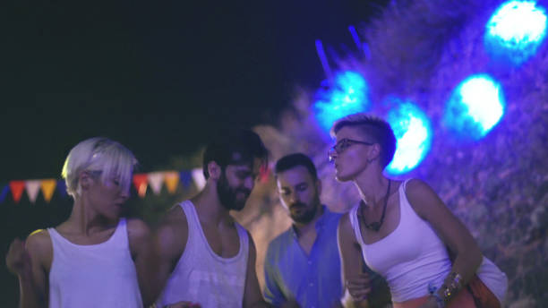 istock People dancing on festival 907889382