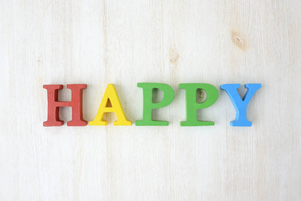 istock Wooden letters, happy 907890100