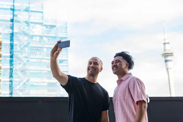 Pacific Islander Men Taking Selfies With Auckland Skytower