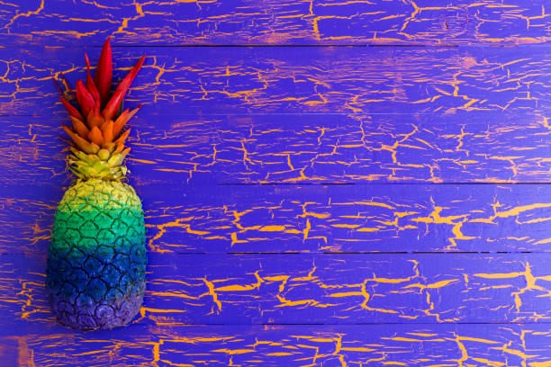 istock Brightly colored pineapple in rainbow colors 907897274