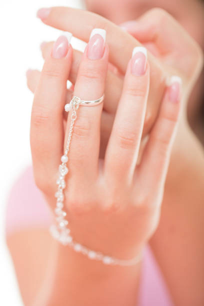 istock Hands With Polished Nails and Bracelet 907901804