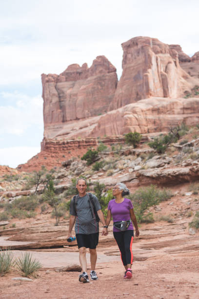 istock Senior Couple Hiking in Desert 907904020