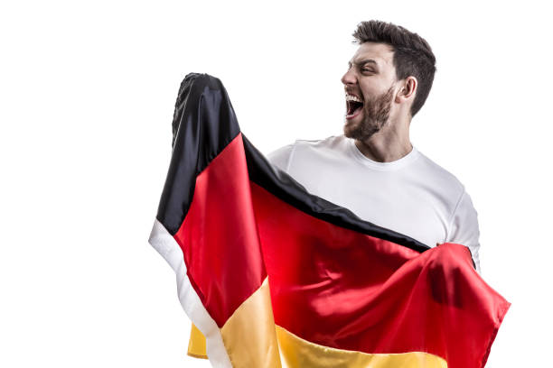 istock German male athlete / fan celebrating on white background 907906916