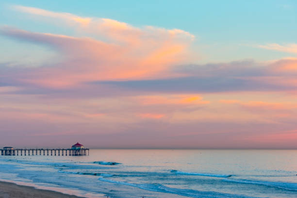 Huntington Beach in California Sunset shot of Huntington Beach in Califirnia huntington beach california stock pictures, royalty-free photos & images
