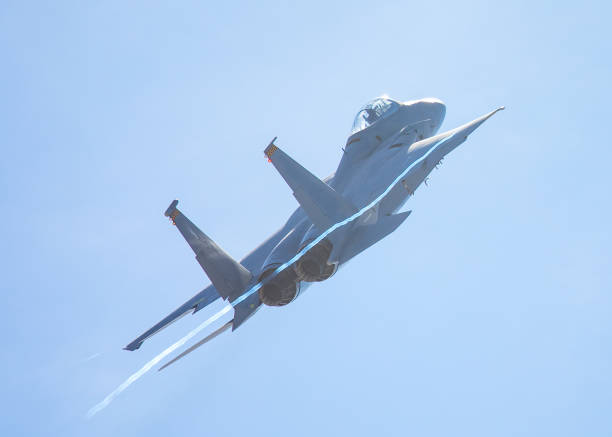 istock F-15 Eagle in a very close rear view, with condensation trails forming at the wing tip 907907580