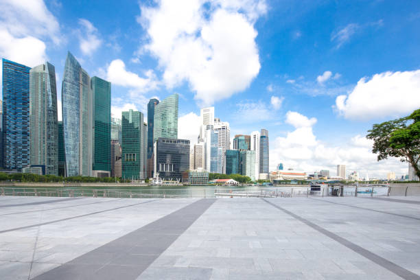istock empty marble floor with modern buildings near water 907908572