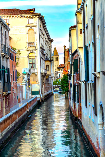 istock Colorful Small Side Canal Bridge Venice Italy 907911068