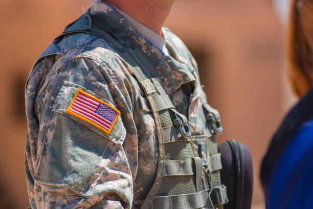 istock USA flag and US Army patch on solder's uniform 907911776