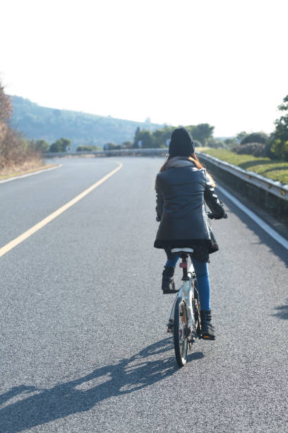istock young woman riding at a sunny winter day 907912788