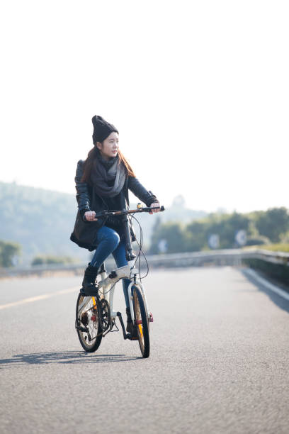 istock young woman riding at a sunny winter day 907912836