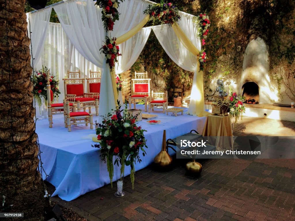Colorful themed wedding stage and chairs.Hindu Traditional Wedding. Wedding Stock Photo