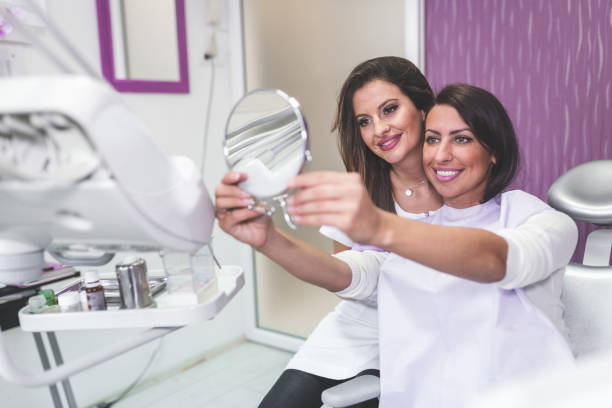 istock Young woman visiting a dentist for a check-up 907913270