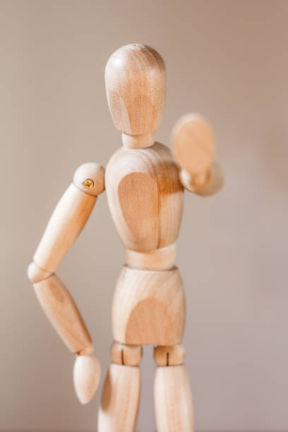 istock Wooden mannequin isolated on white background 907914520