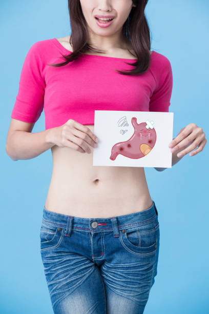istock woman with sick stomach 907915970
