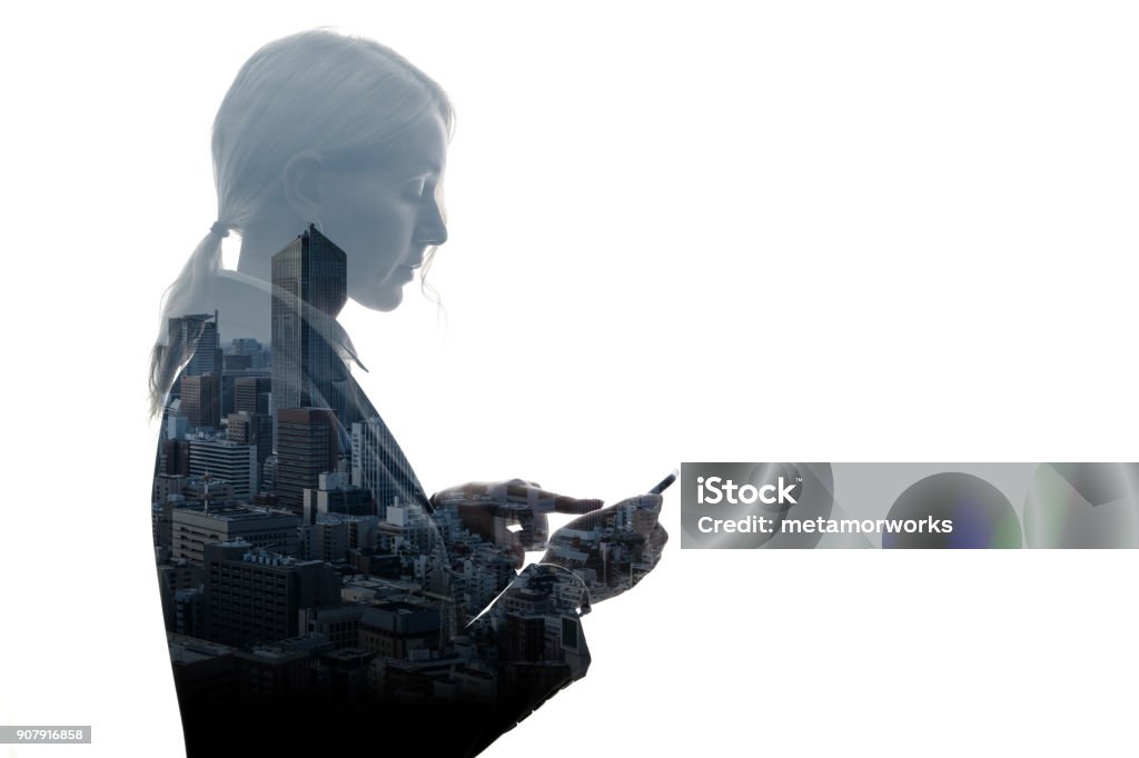 Double exposure of businesswoman and building exterior. Multiple Exposure Stock Photo